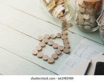 home loan money bank concept with coins stack, House made out of Coins stack, saving account passbook, saving money concept.