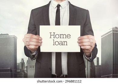 Home Loan On Paper What Businessman Is Holding On Cityscape Background