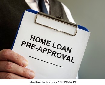 Home Loan Pre Approval And Mortgage Documents In The Hands.