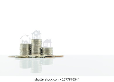 Home loan or refinancing, financial concept : Family in a house on steps of coins, isolated on white background with clipping path, depicts saving money to upgrade assets for better standard of living