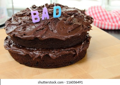 Home Made Chocolate Cake With The Word Bad.