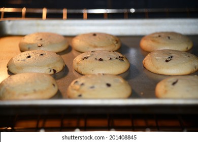 Home Made Chocolate Chip Cookies Baking In A Hot Oven Half Done Still Rising