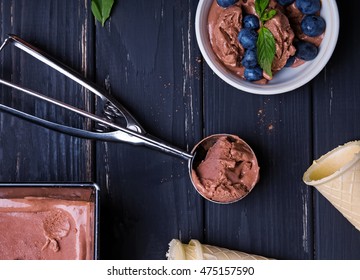 Home Made Chocolate Ice Cream On The Black Wooden Table, Top View