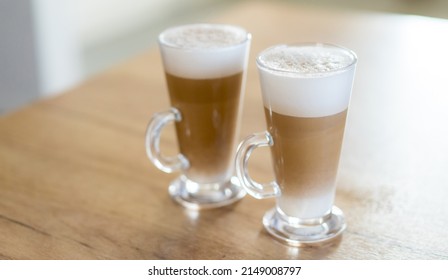 Home Made Coffee Cafe Macchiato On Wooden Table.