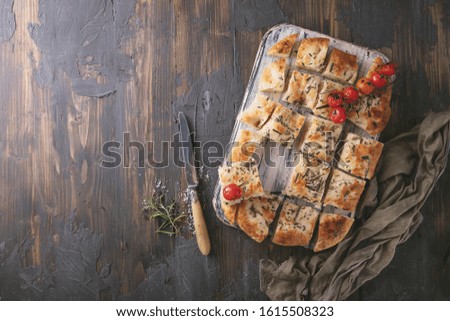 Similar – Focaccia bread with knife and olive oil