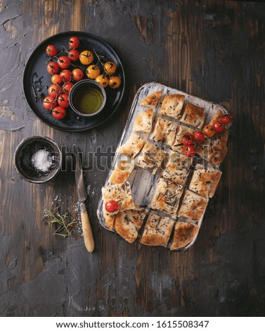 Similar – Focaccia bread with knife and olive oil