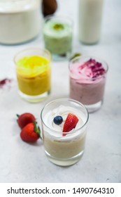 Home Made Fruits Ice Cream With Gold Spoon  On White Table 