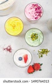 Home Made Fruits Ice Cream With Gold Spoon  On White Table 