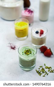 Home Made Fruits Ice Cream With Gold Spoon  On White Table 