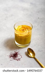 Home Made Fruits Ice Cream With Gold Spoon  On White Table 