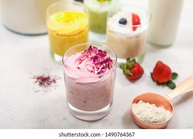 Home Made Fruits Ice Cream With Gold Spoon  On White Table 