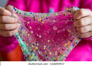 Home made glitter slime glu with coloured beads in it