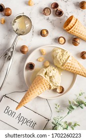 Home Made Ice Cream With Macadamia Nuts In Waffles Cones. Flat Lay. High Key.