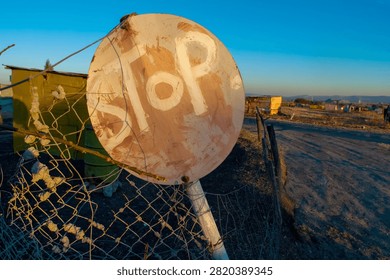 Home made and make shift stop sign in a South Africa township.