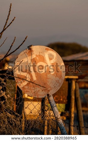 Home made and make shift stop sign in a South Africa township.