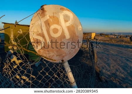 Home made and make shift stop sign in a South Africa township.
