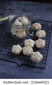 Home Made Of Malaysia Traditional Coconut Cream Cookies Or 'Kuih Bangkit' On The Table Over Dark Background. Famous Delicacy For Hari Raya.