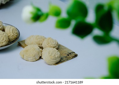 Home Made Of Malaysia Traditional Coconut Cream Cookies Or 'Kuih Bangkit' On The Table White Background. Famous Delicacy For Hari Raya.