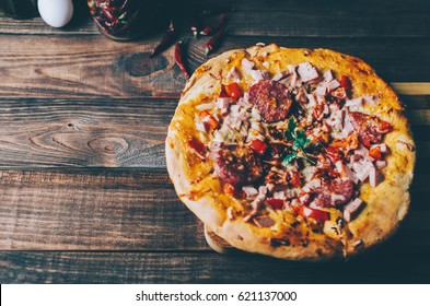 Home made pizza on the black rustic background