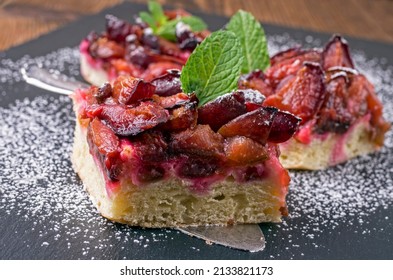 home made plum pie cut in pieces - Powered by Shutterstock