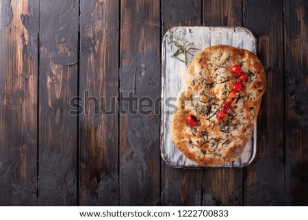 Similar – Focaccia bread with knife and olive oil