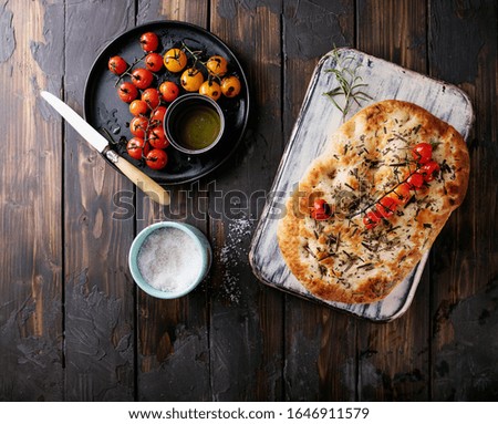 Similar – Focaccia bread with knife and olive oil