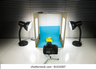 Home Made Still Life Photography Studio Using A Cardboard Box And Desk Lamps.