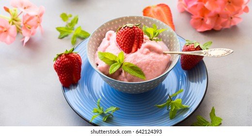 Home Made Strawberry Ice Cream In Bowl With Min Leaves