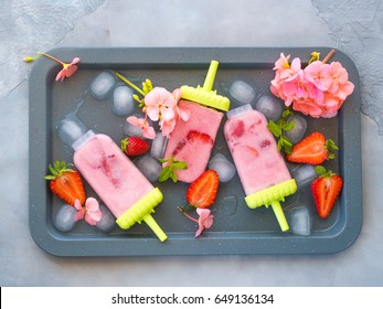 Home Made Strawberry Ice Cream Popsicles On Metall Tray With Ice Cubes