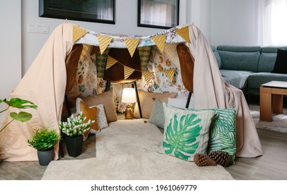 Home Made Tent Made With Three Chairs And Bed Sheets In The Living Room