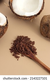 Home Made Texture Scrub With Coconut Coffee On Brown Background. Spa And Home Care Concept, Beauty Procedures, Vertical Photo