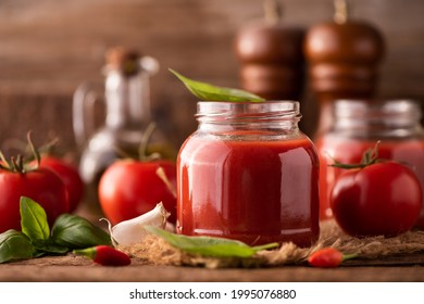 Home Made Tomato Sauce In A Jar On A Wooden Table