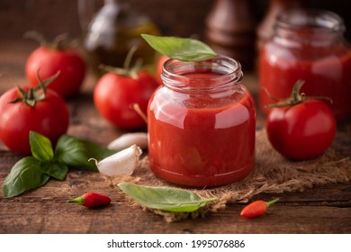 Home Made Tomato Sauce In A Jar On A Wooden Table