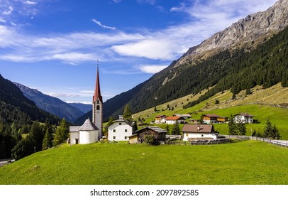Home in mountain valley village in Austria Alps - Shutterstock ID 2097892585