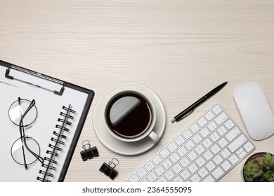 Home office. Coffee, glasses, houseplant, stationery, computer keyboard and mouse on white wooden desk, flat lay. Space for text - Powered by Shutterstock