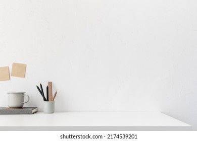 Home Office, Creative Desk With Office Supplies And White Wall. Stylish Interior Desk Close Up.
