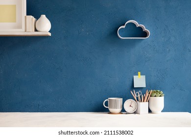 Home Office Desk With Blue Wall And White Table Mock Up.	
