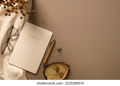 Home office desk table with weekly planner, pen, office stationery, glasses, beige cloth, dried flowers. Elegant, aesthetic feminine workspace. - Shutterstock ID 2125200374