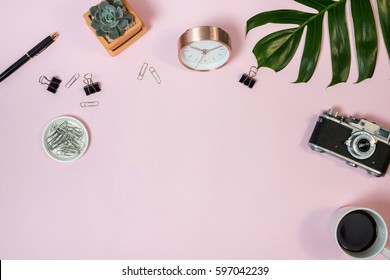 Home office desk. Workspace with vintage camera, clips succulent and accessories. Flat lay, top view - Powered by Shutterstock