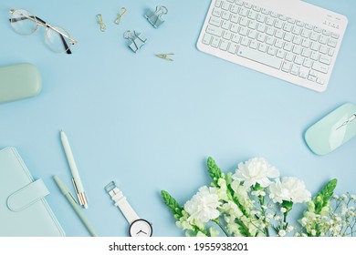 Home Office Desktop And Flowers. Modern Workspace With Notebook, Office Stationary