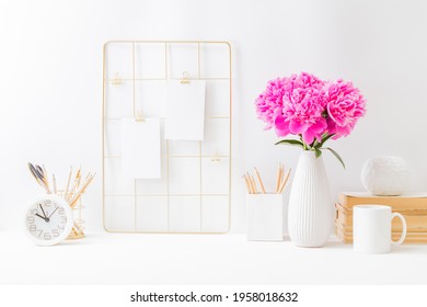 Home Office Desktop And Mood Board With Empty Card, Pink Peonies In A Vase, Office Supplies On A Light Background