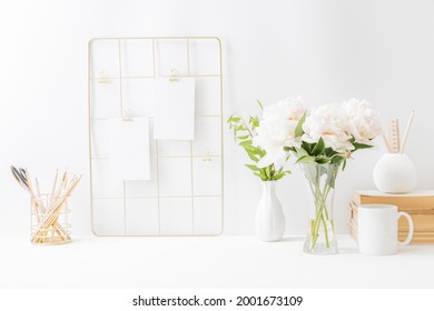 Home Office Desktop And Mood Board With Empty Card, White Peonies In A Vase, Office Supplies On A Light Background