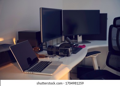 home office photographer workplace with workstation computer  and dual screen monitor modern laptop and medium format dslr camera - Powered by Shutterstock