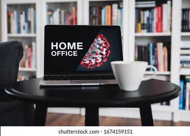 Home office theme. Home office during coronavirus pandemic. Novel coronavirus 2019 COVID-19 theme. Coronavirus wallpaper on computer. Coffee Cup in foreground.