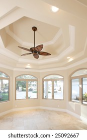 Home Office With A Vaulted Ceiling And Fan