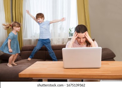 Home office. Working from home vs. Mom with two kids Work on the Internet on a laptop at home. quarantine. Corona Virus.  - Shutterstock ID 1675139362
