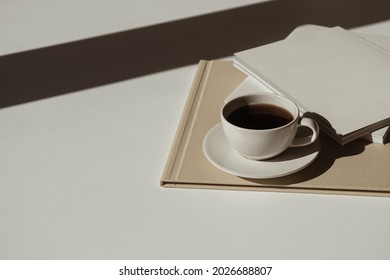 Home Office Workspace With Notebook Sheet, Coffee Cup, Marble Tray In Sunlight Shadows. Aesthetic Luxury Bohemian Minimal Lady Boss Business Lifestyle Concept