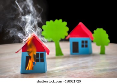 Home On Fire House Model, Risk Or Property Insurance Protection