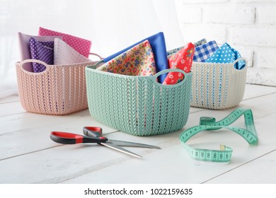 Home Organizers Colored Baskets With Handmade Accessories On Whote Table