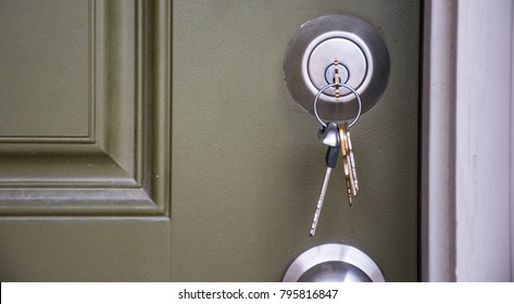 Home Ownership the day you get your new Keys to your new home. House keys inside door lock